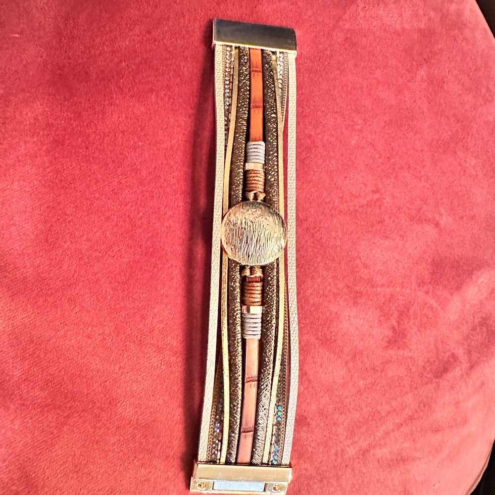 Bracelet with magnetic clasp. Like new condition. Gold earth tone jewelry